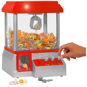 Ein roter Candy Grabber Süßigkeiten Automat